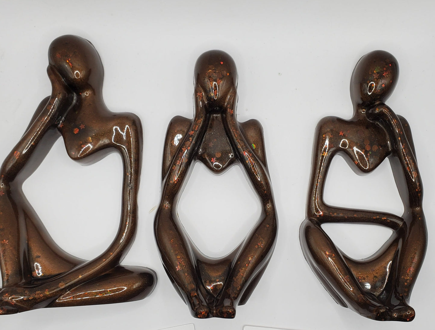 Three statues adding a touch of sophistication to any space. Perfect home decor thinker statues.