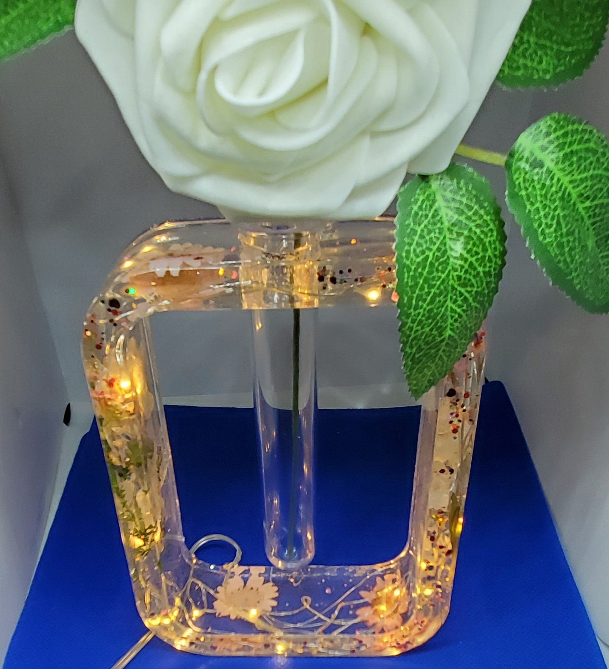 Beautiful flower vase with lights, butterflies and flowers.